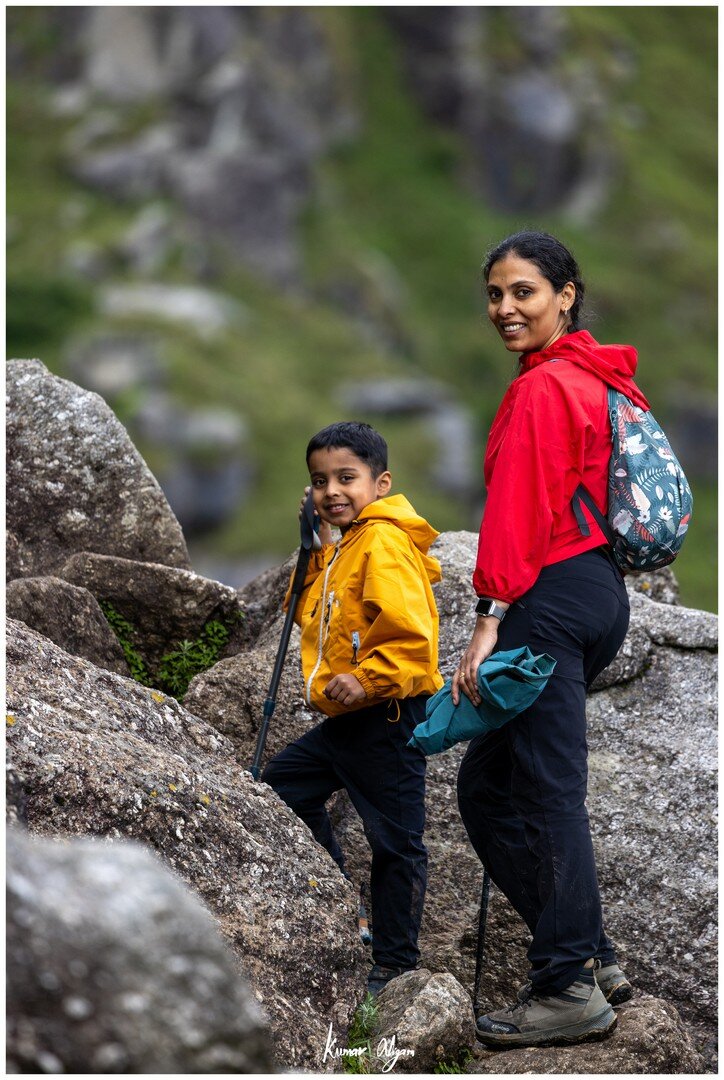Yuvan and Ma taking a short rest among the rocks
