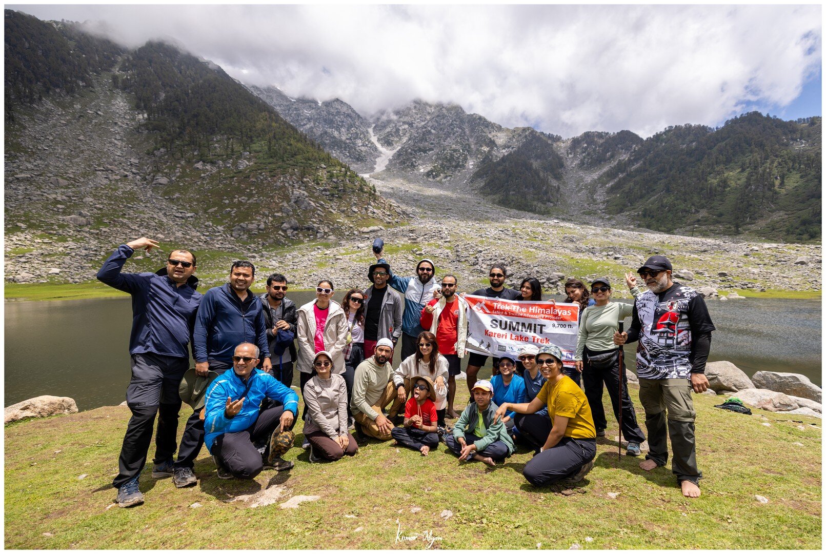 The whole trekking group posing with the Summit Kareri Lake Trek banner